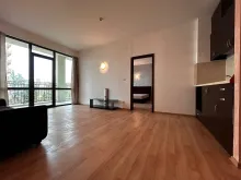 sofa, szafka pod telewizor, aneks kuchenny