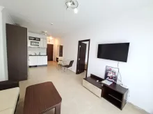 Telewizor i meble w apartamencie